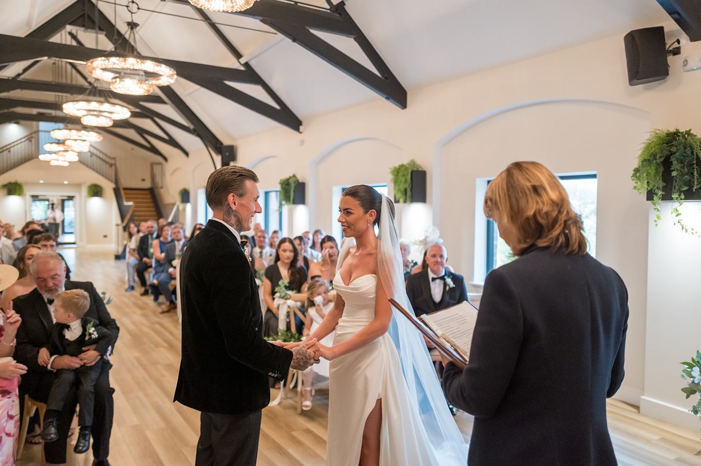 Wedding ceremony in the barn at Ellie and Thomas’s The Whistle Barns wedding