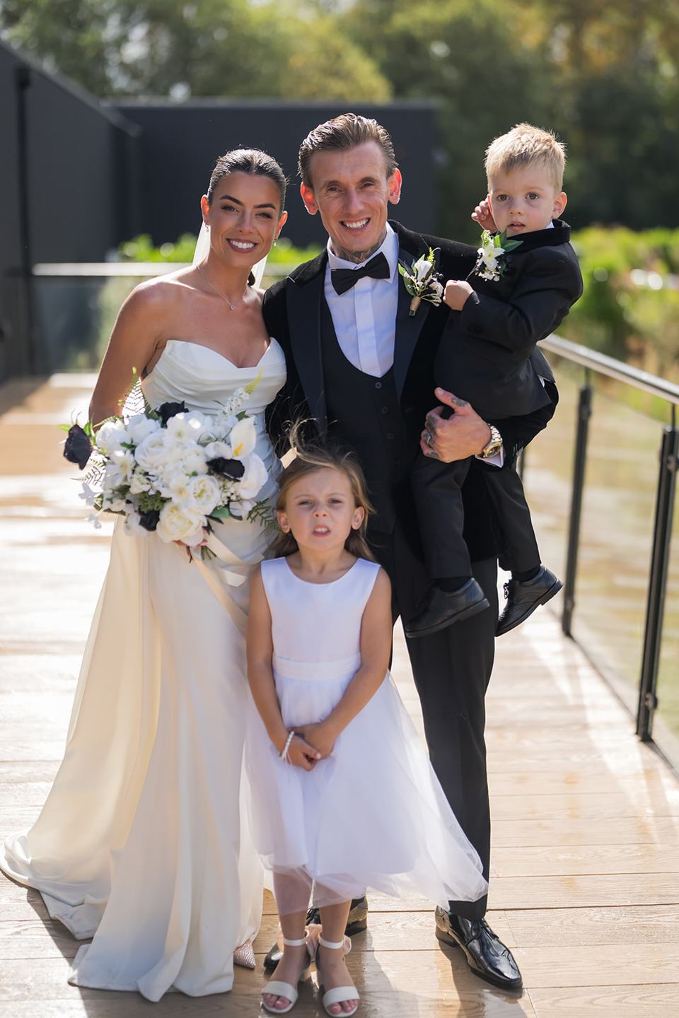 Family photographs on the terrace at Ellie and Thomas’s The Whistle Barns wedding