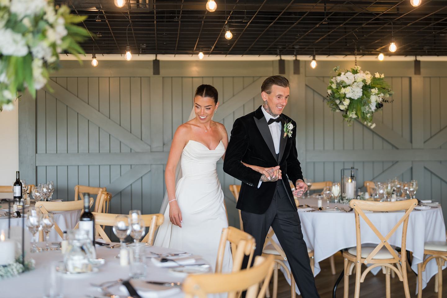 Wedding breakfast room at Ellie and Thomas’s The Whistle Barns wedding