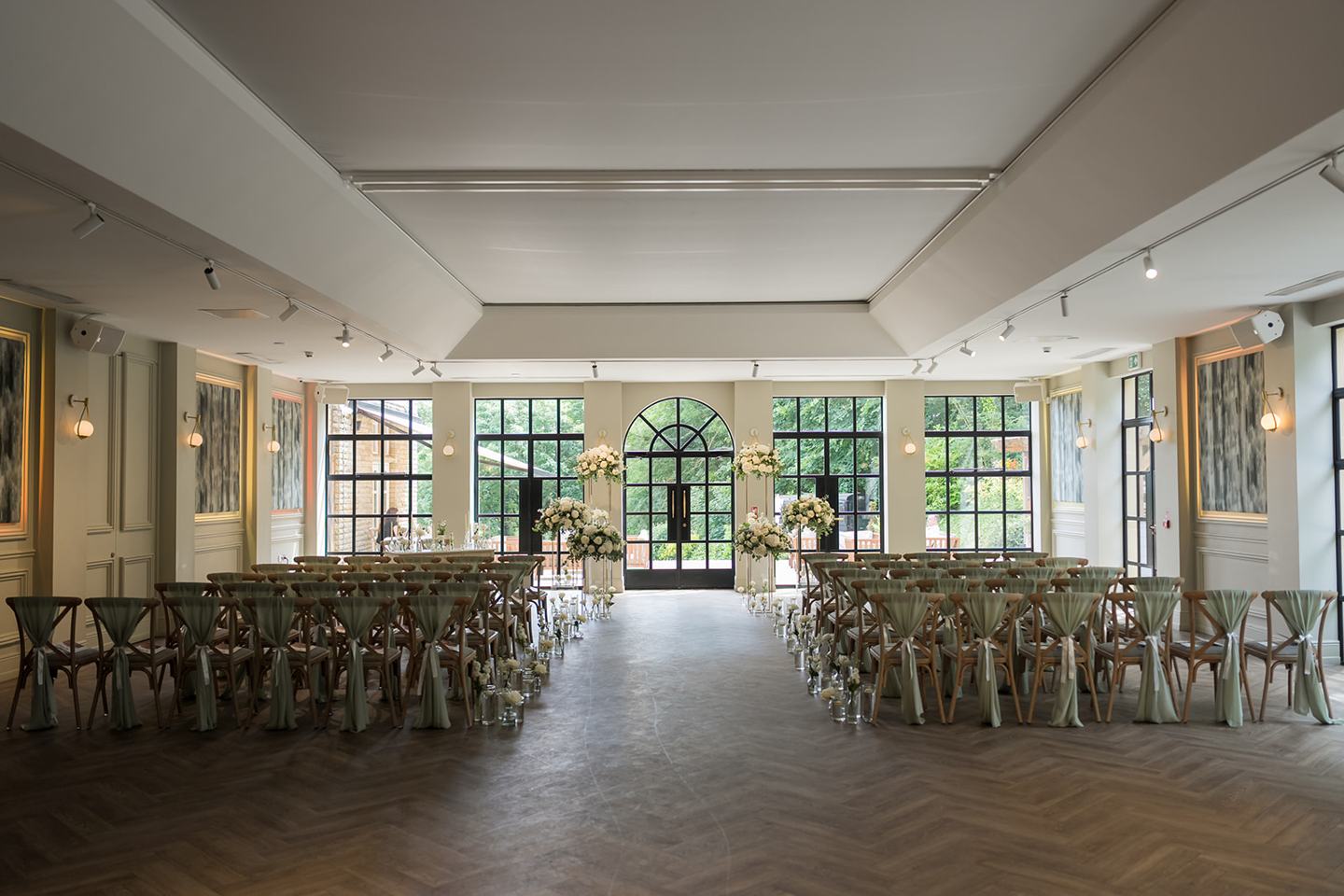 Ceremony room beneath the glass roof at Chloe and James’s Woodlands Hotel wedding