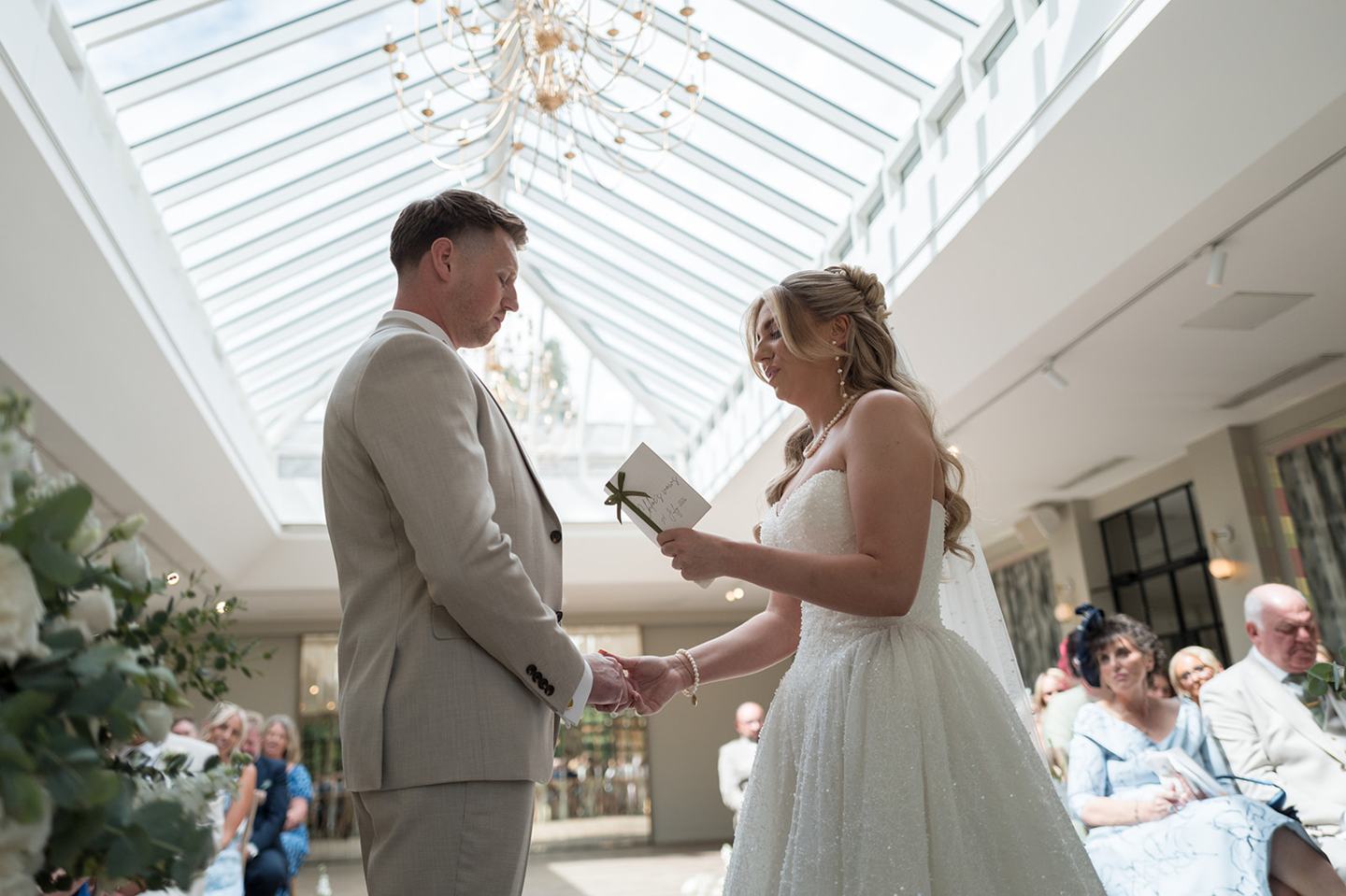 Exchanging wedding vows at Chloe and James’s Woodlands Hotel wedding