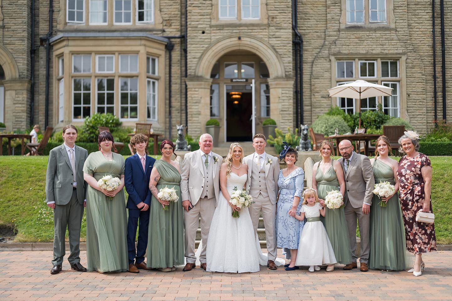 Family photographs outside Woodlands at Chloe and James’s Woodlands Hotel wedding