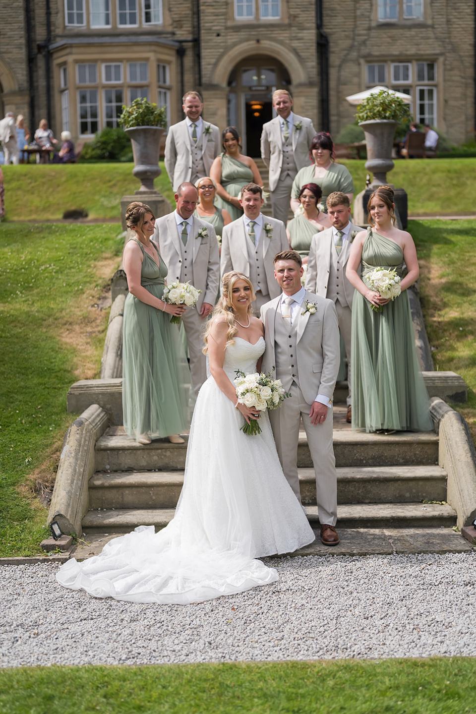 Bride and bridesmaids on the steps at Chloe and James’s Woodlands Hotel wedding