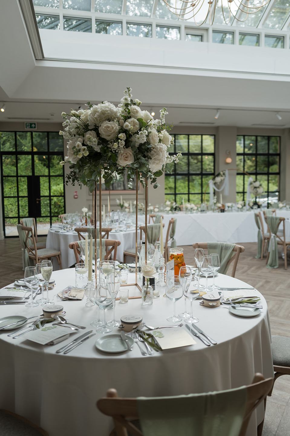 Wedding breakfast tables at Chloe and James’s Woodlands Hotel wedding