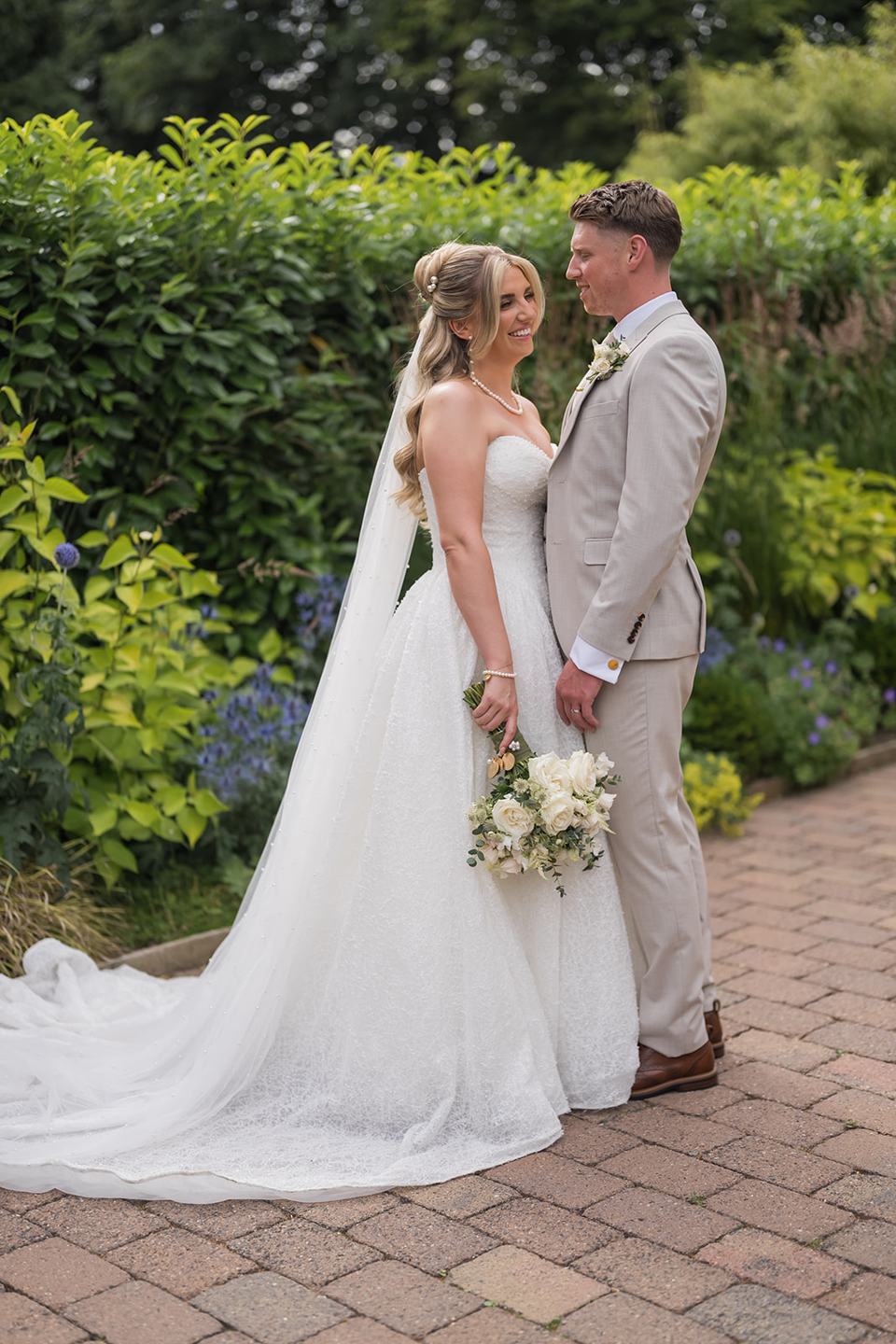 Couple portrait in the gardens at Chloe and James’s Woodlands Hotel wedding